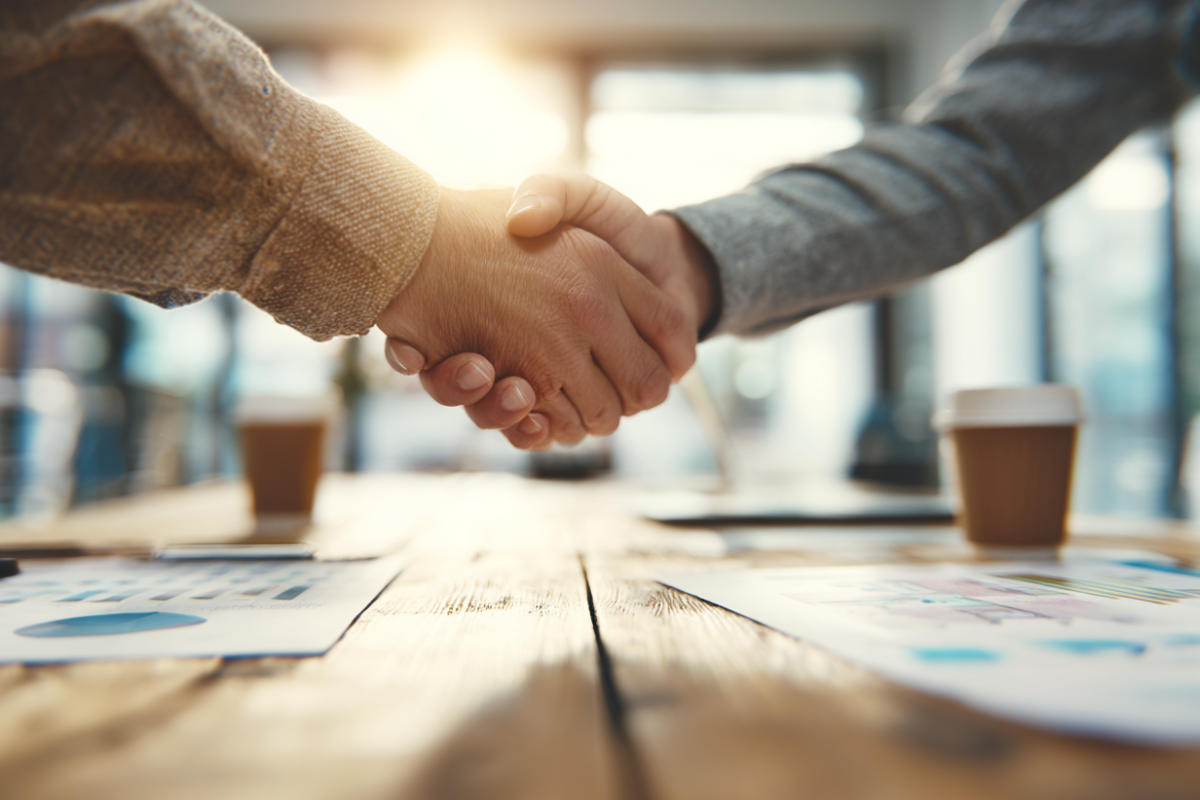 Business Kooperation Handschlag Buero